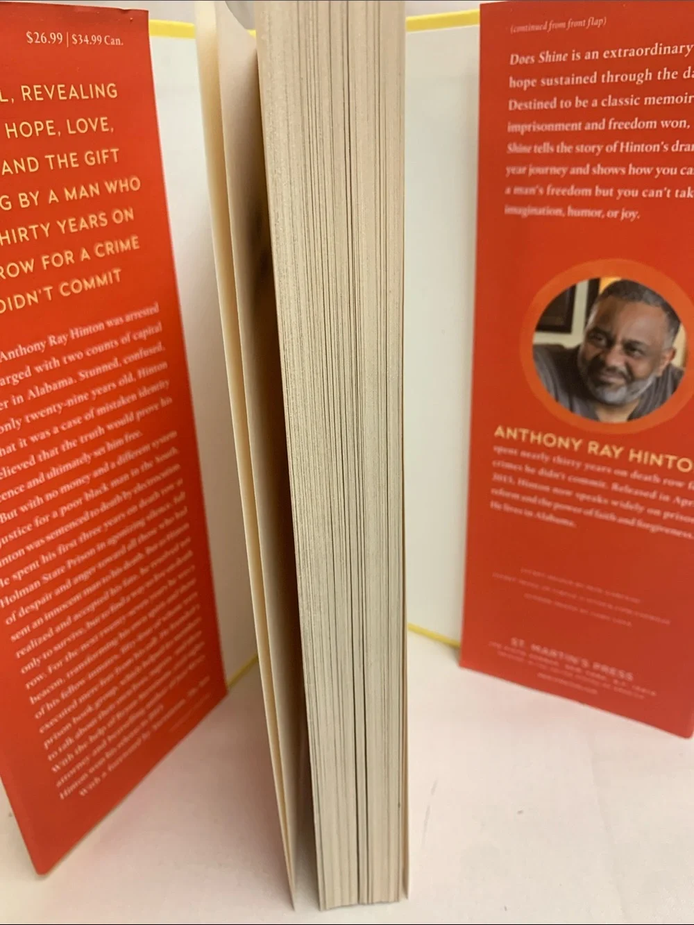 The Sun Does Shine by Anthony Ray Hinton — Orange Hardcover Book